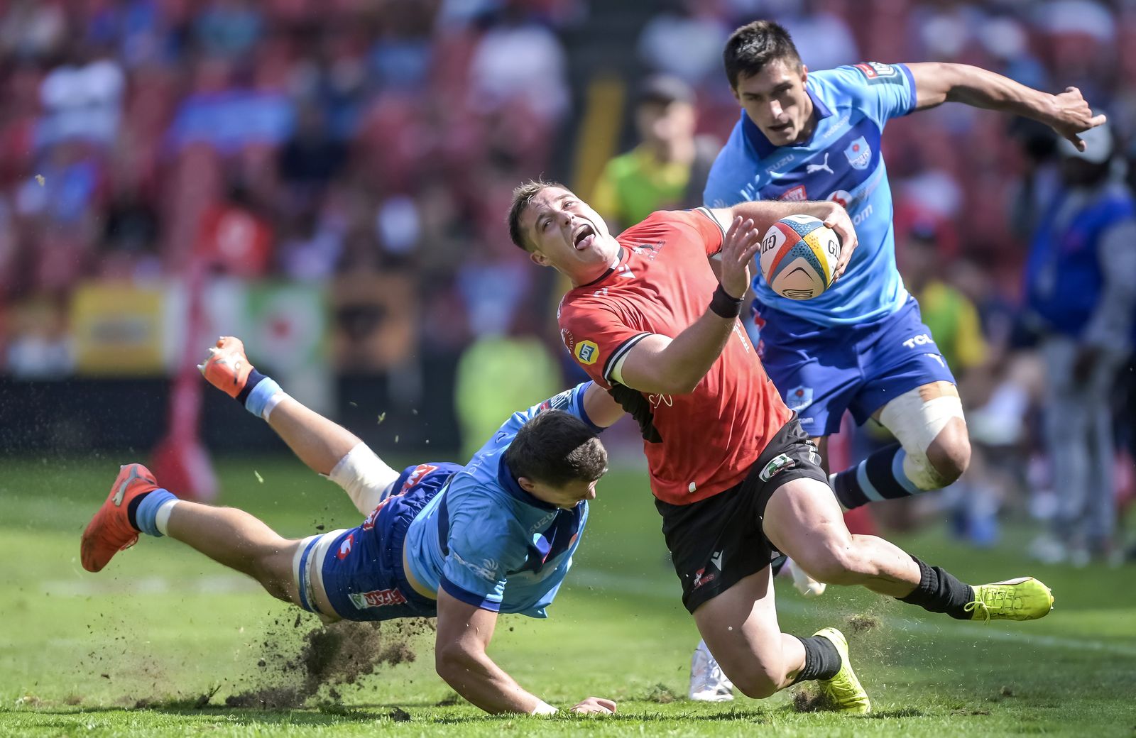 Elrich Louw of the Vodacom Bulls tackles Henco van Wyk of the Lions