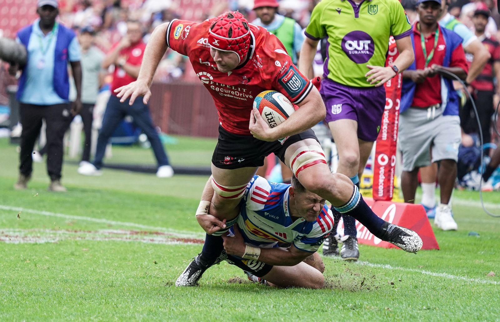 Francke Horn of the Lions is tackled by Stefan Ungerer of the DHL Stormers
